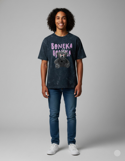 Person wearing a t-shirt with 'Boneka' design on a gray background